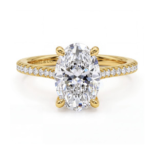 Gabriel & Co. ER16129O14Y44JJ 14 karat yellow gold Contemporary engagement ring, front view of an oval center with four rounded prongs and diamonds running along both shoulders