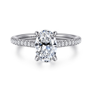 Gabriel & Co. ER16129O6W44JJ 14 karat white gold Contemporary engagement ring, front view of an oval center with four slim claw prongs and round diamonds on both shoulders