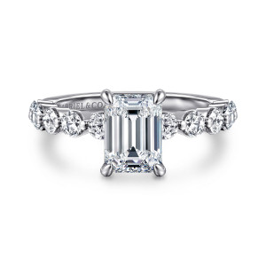 Gabriel & Co. ER16130E6W44JJ 14 karat white gold Classic engagement ring, front view of an emerald cut center with round diamonds separated by small beads along the shoulders