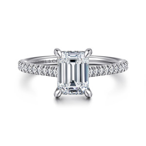 Gabriel & Co. ER16131E6W44JJ 14 karat white gold Classic engagement ring, front view of an emerald cut center held by four rounded prongs with diamonds along both shoulders