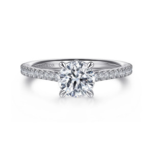 Gabriel & Co. ER16131R4PT4JJ platinum Classic engagement ring, front view of a round center in rounded prongs with small diamonds along the shoulders