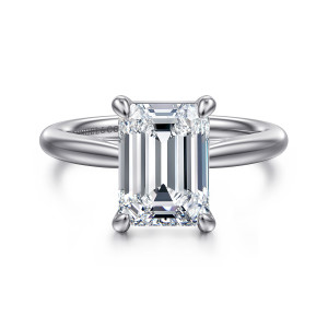 Gabriel & Co. ER16132E12W4JJJ 14 karat white gold Classic engagement ring, front view of an emerald cut center held by four rounded prongs on a smooth band