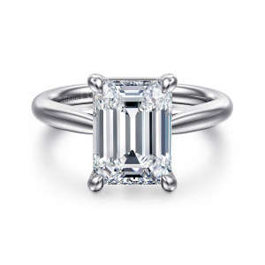 Gabriel & Co. ER16132E16W4JJJ 14 karat white gold Classic engagement ring, front view of an emerald cut center held by four rounded prongs on a smooth band