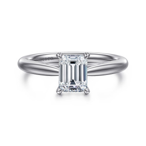 Gabriel & Co. ER16132E4W4JJJ 14 karat white gold Classic engagement ring, front view of an emerald cut center held by four corner prongs above a smooth tapered band