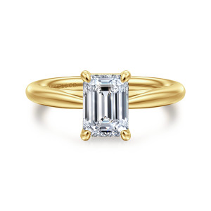 Gabriel & Co. ER16132E6Y4JJJ 14 karat yellow gold Classic engagement ring, front view of an emerald cut center held by rounded prong tips over a smooth band