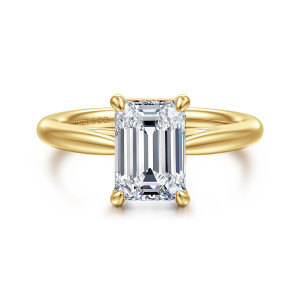 Gabriel & Co. ER16132E8Y4JJJ 14 karat yellow gold Classic engagement ring, front view of an emerald cut center held by four rounded prongs on a smooth tapered band