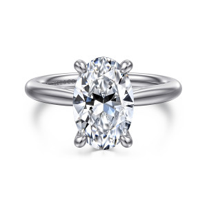 Gabriel & Co. ER16132O12W4JJJ 14 karat white gold Classic engagement ring, front view of an oval center held by rounded tipped prongs above a smooth band