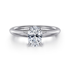 Gabriel & Co. ER16132O4W4JJJ 14 karat white gold Classic engagement ring, front view of an oval center held by four claws on a smooth slim band