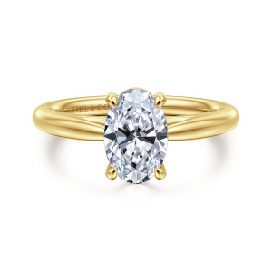 Gabriel & Co. ER16132O6VY4JJJ 14 karat yellow gold Classic engagement ring, front view of the oval center between rounded prong tips on a plain tapering band