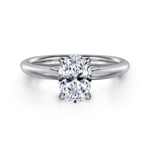 Gabriel & Co. ER16132O6W4JJJ 14 karat white gold Classic engagement ring, front view of an oval center held by four slim prongs on a smooth rounded band