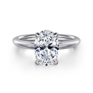 Gabriel & Co. ER16132O8W4JJJ 14 karat white gold Classic engagement ring, front view of an oval center held by four rounded claw prongs on a smooth band