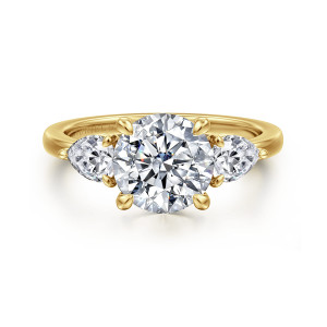 Gabriel & Co. ER16135R8Y44JJ 14 karat yellow gold Contemporary engagement ring, front view of a round center with four prongs and pear shaped diamonds with tiny tip prongs