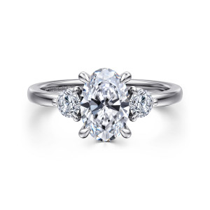 Gabriel & Co. ER16136O6W44JJ 14 karat white gold Contemporary engagement ring, front view of an oval center with a round stone tucked against each side