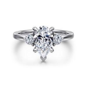 Gabriel & Co. ER16136P6W44JJ 14 karat white gold Contemporary engagement ring, front view of a pear shaped center with a V tip and a round diamond on each side