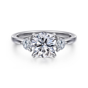 Gabriel & Co. ER16136R6W44JJ 14 karat white gold Contemporary engagement ring, front view of a round center in teardrop tipped prongs between two smaller round stones