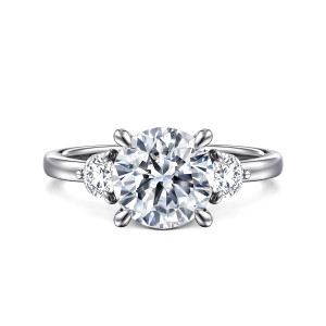 Gabriel & Co. ER16136R8W44JJ 14 karat white gold Contemporary engagement ring, front view of a round center flanked by round side stones and four rounded claws