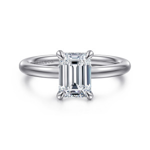 Gabriel & Co. ER16138E6W44JJ 14 karat white gold Classic engagement ring, front view of an emerald cut center in four claws on a smooth, rounded band with no stones