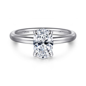 Gabriel & Co. ER16138O6W44JJ 14 karat white gold Classic engagement ring, front view of an oval center in four claw prongs on a smooth rounded band