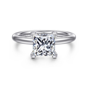 Gabriel & Co. ER16138S6W44JJ 14 karat white gold Classic engagement ring, front view of a princess cut center gripped at its corners on a smooth rounded band