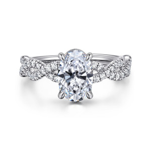 Gabriel & Co. ER16142O6W44JJ 14 karat white gold Contemporary engagement ring, front view of an oval center in four rounded claw prongs between crossing strands of small diamonds