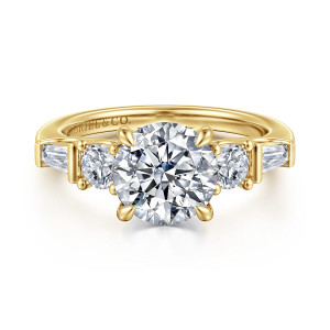 Gabriel & Co. ER16179R8Y44JJ 14 karat yellow gold Contemporary engagement ring, front view of a round center with a round stone and tapered baguette on each side