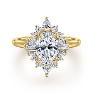 Gabriel & Co. ER16185O6Y44JJ 14 karat yellow gold Starlight engagement ring, front view of an oval center with a fan of tapered baguettes at each side