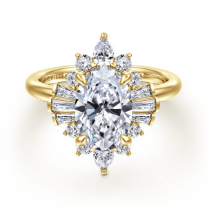 Gabriel & Co. ER16185O8Y44JJ 14 karat yellow gold Starlight engagement ring, front view of a starburst of round, baguette and elongated stones around an oval center