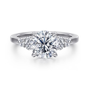 Gabriel & Co. ER16192R8W44JJ 14 karat white gold Classic engagement ring, front view of a round center flanked by elongated and round stones stepping down each shoulder