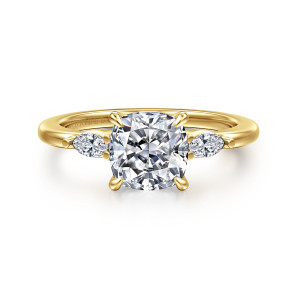 Gabriel & Co. ER16198C8Y43JJ 14 karat yellow gold Classic engagement ring, front view of a cushion center between elongated side stones and four slender prongs
