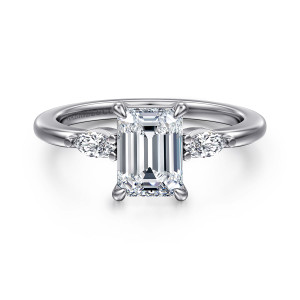 Gabriel & Co. ER16198E6W43JJ 14 karat white gold Classic engagement ring, front view of an emerald cut center between two small elongated side diamonds