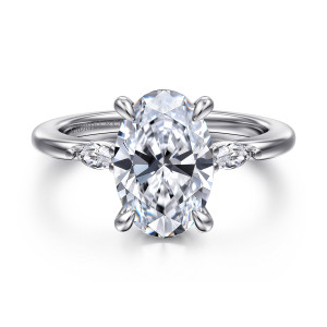 Gabriel & Co. ER16198O12W43JJ 14 karat white gold Classic engagement ring, front view of an oval center with teardrop tipped prongs and small stones at each side