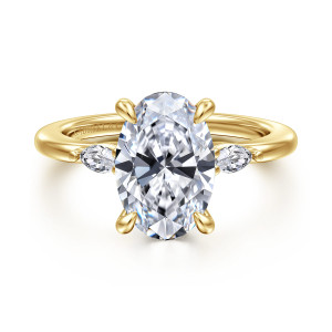 Gabriel & Co. ER16198O12Y43JJ 14 karat yellow gold Classic engagement ring, front view of an oval center between two small elongated diamonds and teardrop shaped prongs