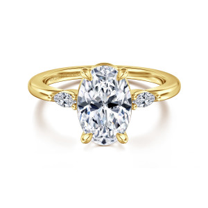 Gabriel & Co. ER16198O8Y43JJ 14 karat yellow gold Classic engagement ring, front view of the oval center with leaf tipped prongs and a bead beside each side stone