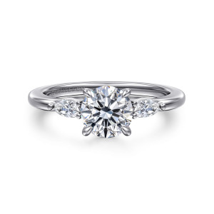 Gabriel & Co. ER16198R4W43JJ 14 karat white gold Classic engagement ring, front view of a round center with a slim elongated diamond on each shoulder