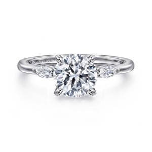 Gabriel & Co. ER16198R6W43JJ 14 karat white gold Classic engagement ring, front view of a round center between two elongated side stones above a smooth polished band
