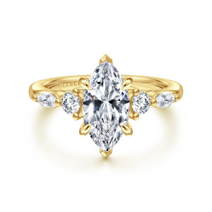 Gabriel & Co. ER16199M6Y44JJ 14 karat yellow gold Contemporary engagement ring, front view of a marquise center with pointed tip prongs and stones stepping out each side