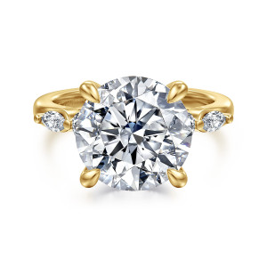 Gabriel & Co. ER16199R20Y44JJ 14 karat yellow gold Contemporary engagement ring, front view of a large round center with four rounded prongs and an elongated diamond at each side