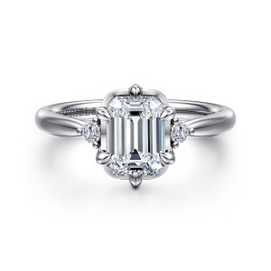 Gabriel & Co. ER16200E6W44JJ 14 karat white gold Contemporary engagement ring, front view of an emerald cut center in a squared frame flanked by small round stones