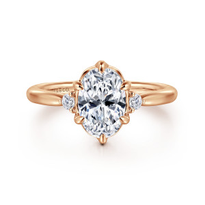 Gabriel & Co. ER16200O6K44JJ 14 karat rose gold Contemporary engagement ring, front view of the oval seat with pointed prongs, a scalloped rim and a diamond each side