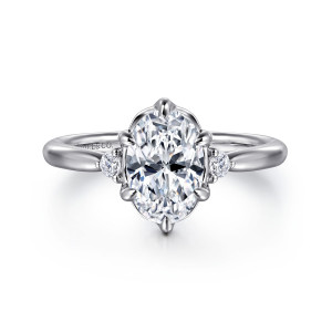 Gabriel & Co. ER16200O6W44JJ 14 karat white gold Contemporary engagement ring, front view of an oval center in a scalloped head with pointed claws and side diamonds