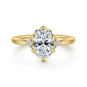 Gabriel & Co. ER16200O6Y44JJ 14 karat yellow gold Contemporary engagement ring, front view of an oval center inside a scalloped frame with a small diamond on each side