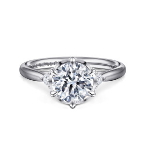 Gabriel & Co. ER16200R6W44JJ 14 karat white gold Contemporary engagement ring, front view of a round center with pointed prongs around it and a small diamond at each side