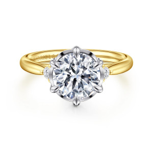 Gabriel & Co. ER16200R8M44JJ 14 karat white and yellow gold Contemporary engagement ring, front view of leaf tipped prongs around a round center with a diamond on each shoulder