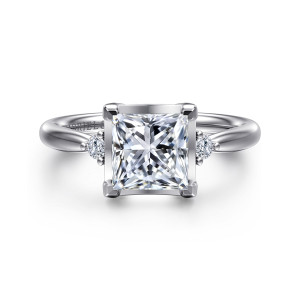 Gabriel & Co. ER16200S6W44JJ 14 karat white gold Contemporary engagement ring, front view of a princess cut center with angular corner prongs and a small diamond on each side