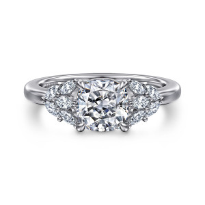 Gabriel & Co. ER16202C6W43JJ 14 karat white gold Floral Nouveau engagement ring, front view of a cushion cut center flanked by leaf like clusters of elongated diamonds on both shoulders