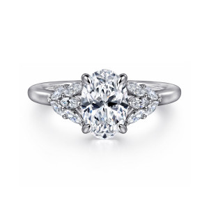 Gabriel & Co. ER16202O6W43JJ 14 karat white gold Floral Nouveau engagement ring, front view of an oval center with a leaf like cluster of small diamonds on each shoulder
