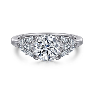 Gabriel & Co. ER16202R6W43JJ 14 karat white gold Floral Nouveau engagement ring, front view of a round center flanked by fanned clusters of elongated small diamonds