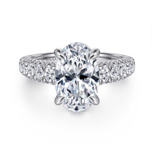 Gabriel & Co. ER16215O12W44JJ 14 karat white gold Contemporary engagement ring, front view of an oval center on claw prongs above a wide band of large and small stones