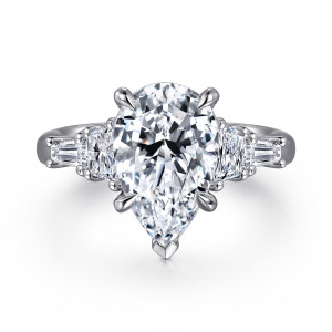 Gabriel & Co. ER16216P12W43JJ 14 karat white gold Classic engagement ring, front view of a pear shaped center with a V shaped tip prong and stepped side stones