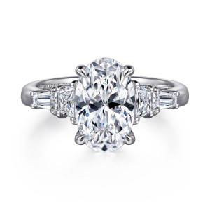 Gabriel & Co. ER16217O12W43JJ 14 karat white gold Classic engagement ring, front view of an oval center with a trapezoid stone and a tapered baguette on each side